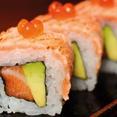 Filled with salmon and avocado and covered with seared salmon, and salmon roe on top