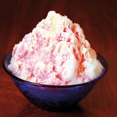 Shaved ice with strawberry syrup and condensed milk