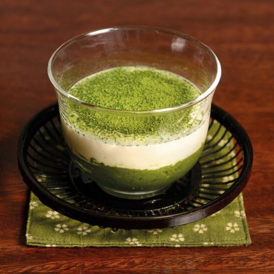 Base of homemade green tea cake, homemade mascarpone cream and Matcha powder on top